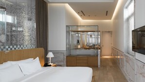 A modern hotel room with a large bed, a vanity with a mirror, and a television. - Macalister Mansion (George Town)