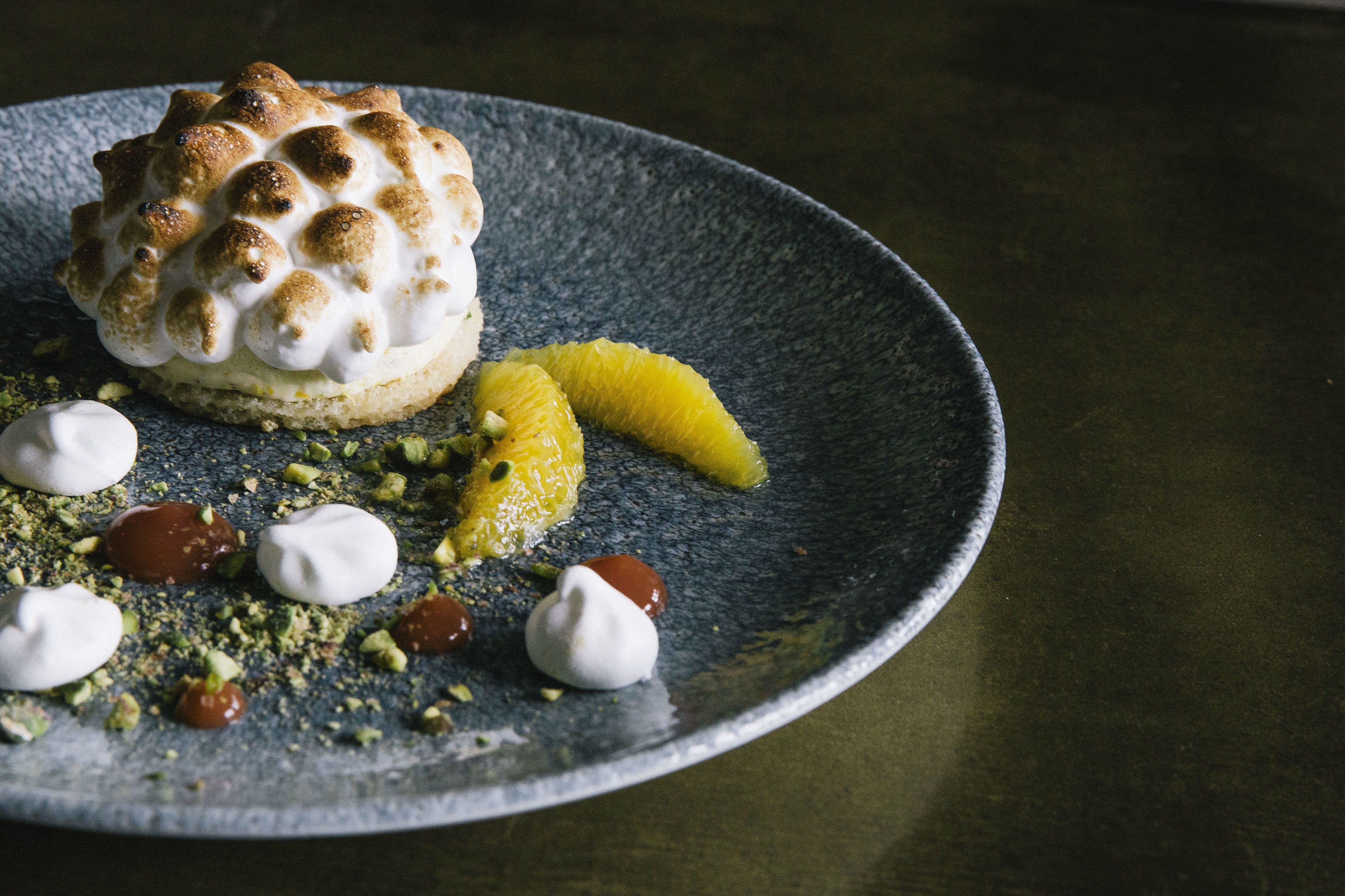 A dessert on a plate with a textured surface.