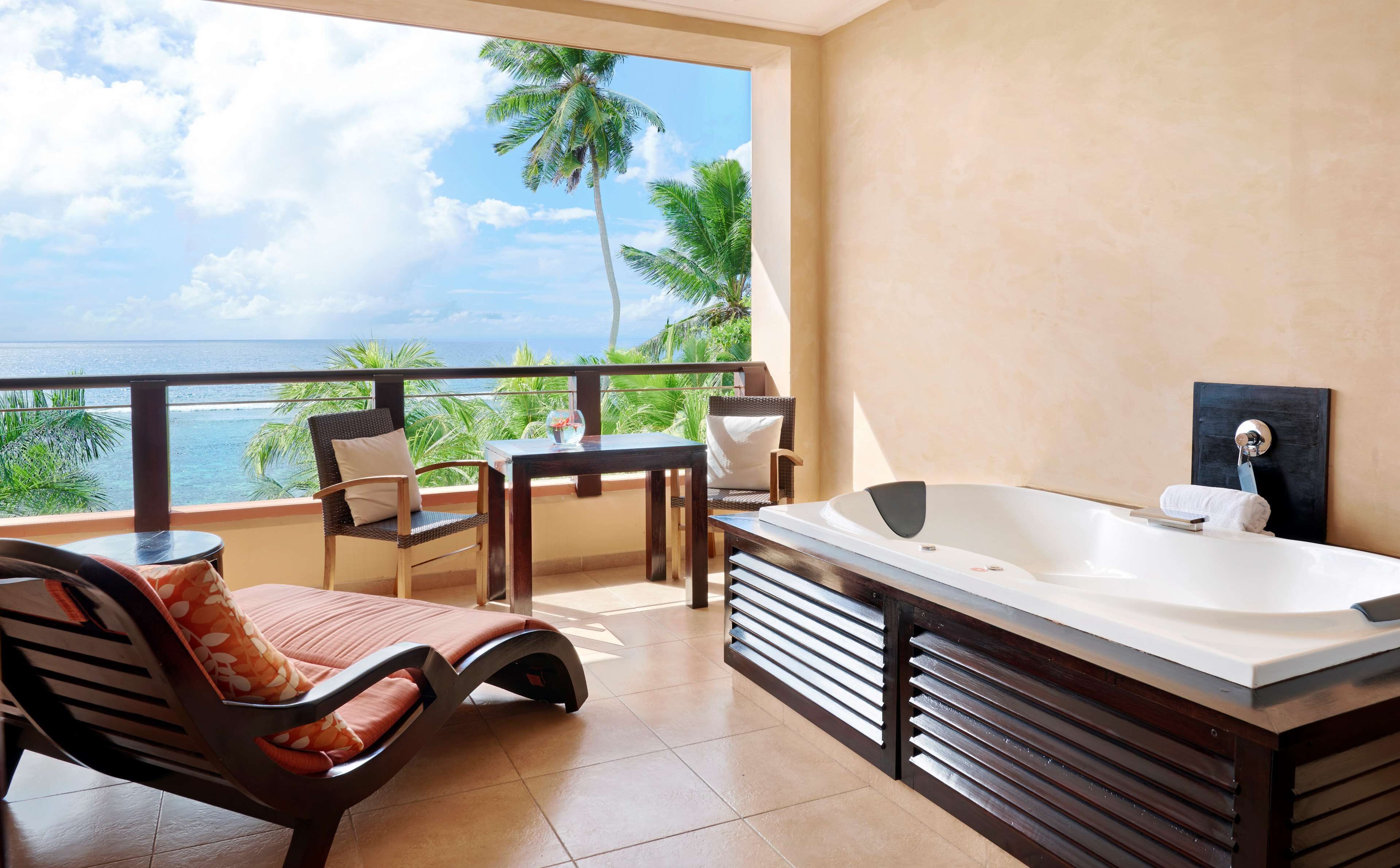 grand room, 1 king bed, beach view, jacuzzi on balcony | bathroom | shower, free toiletries, hair dryer, bathrobes
