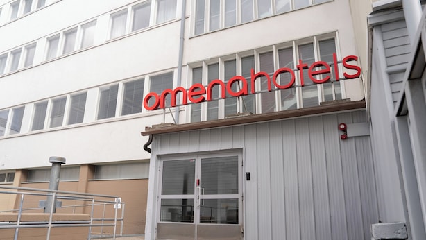A building with a sign reading "omenahotels" above the entrance. - Omena Hotel Jyväskylä (Jyväskylä)