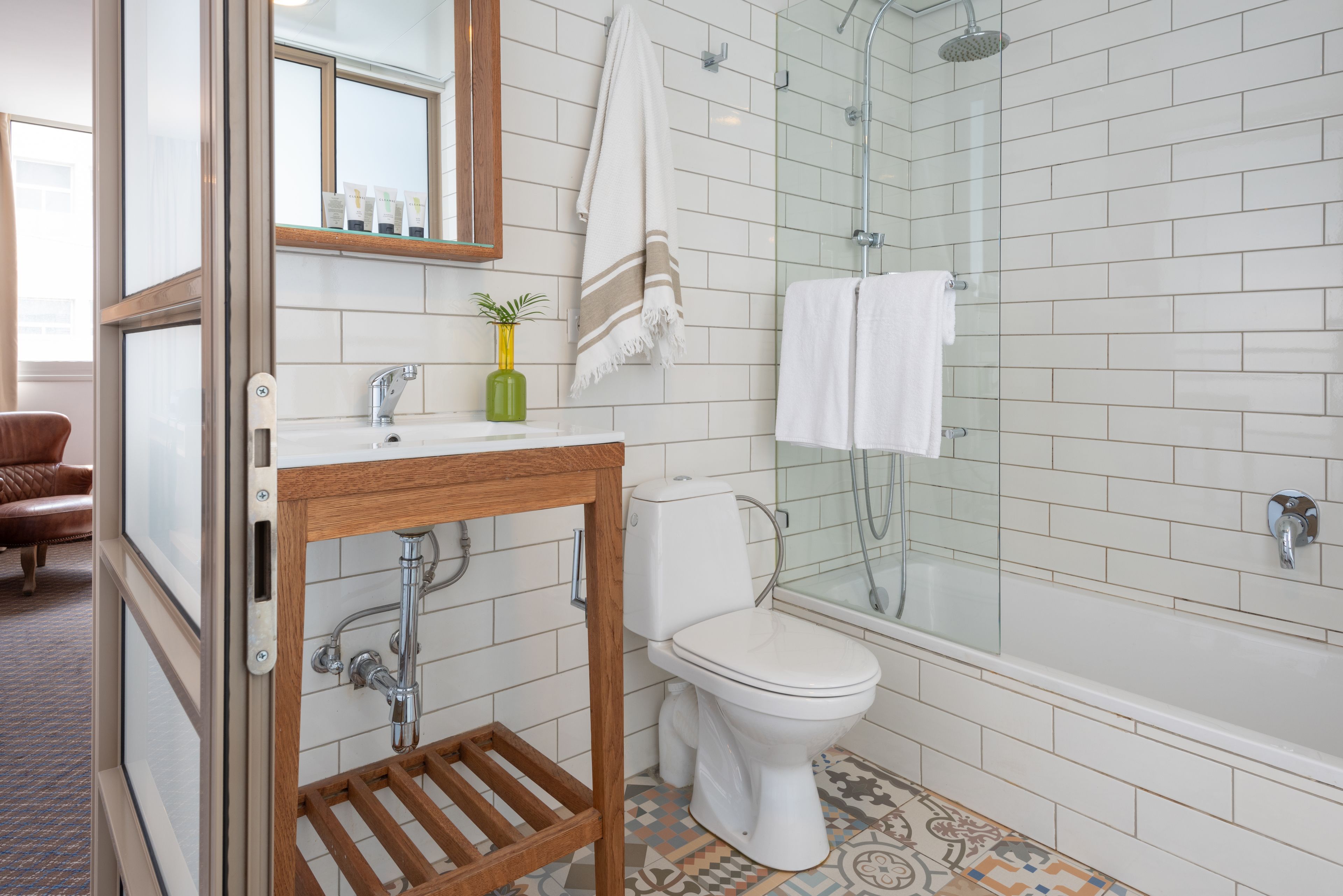 junior suite | bathroom | designer toiletries, hair dryer, towels