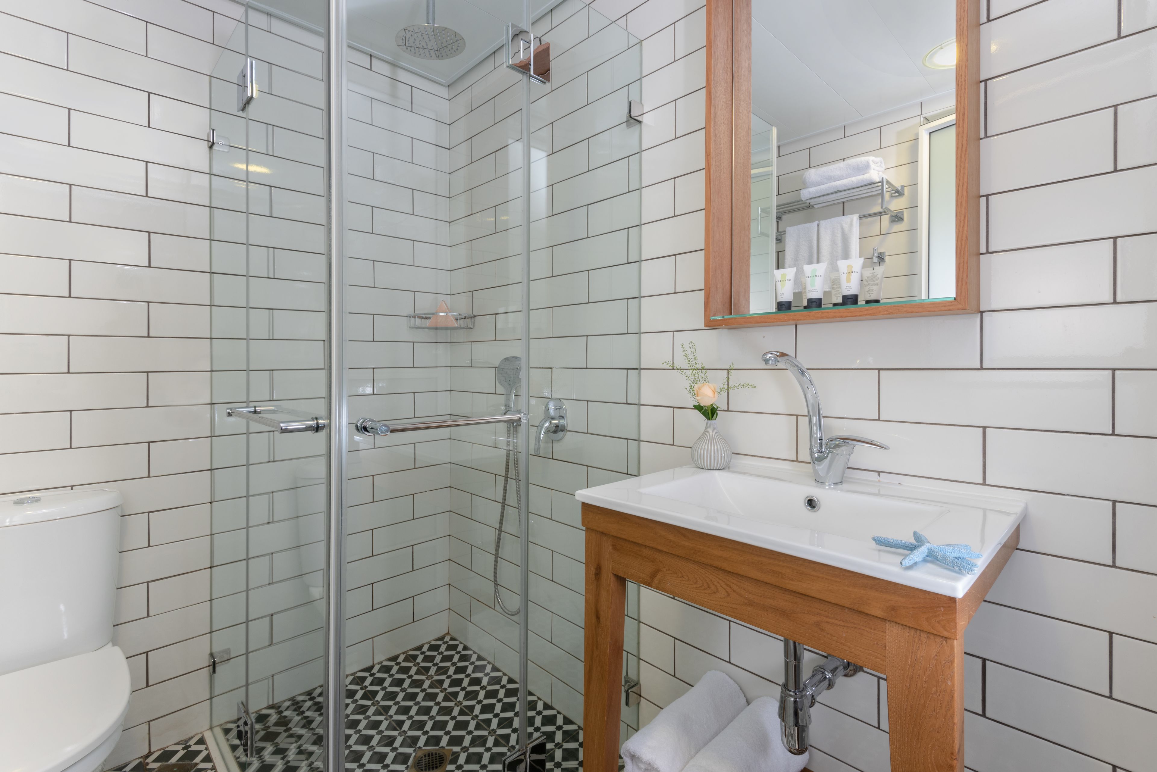 designer toiletries, hair dryer, towels