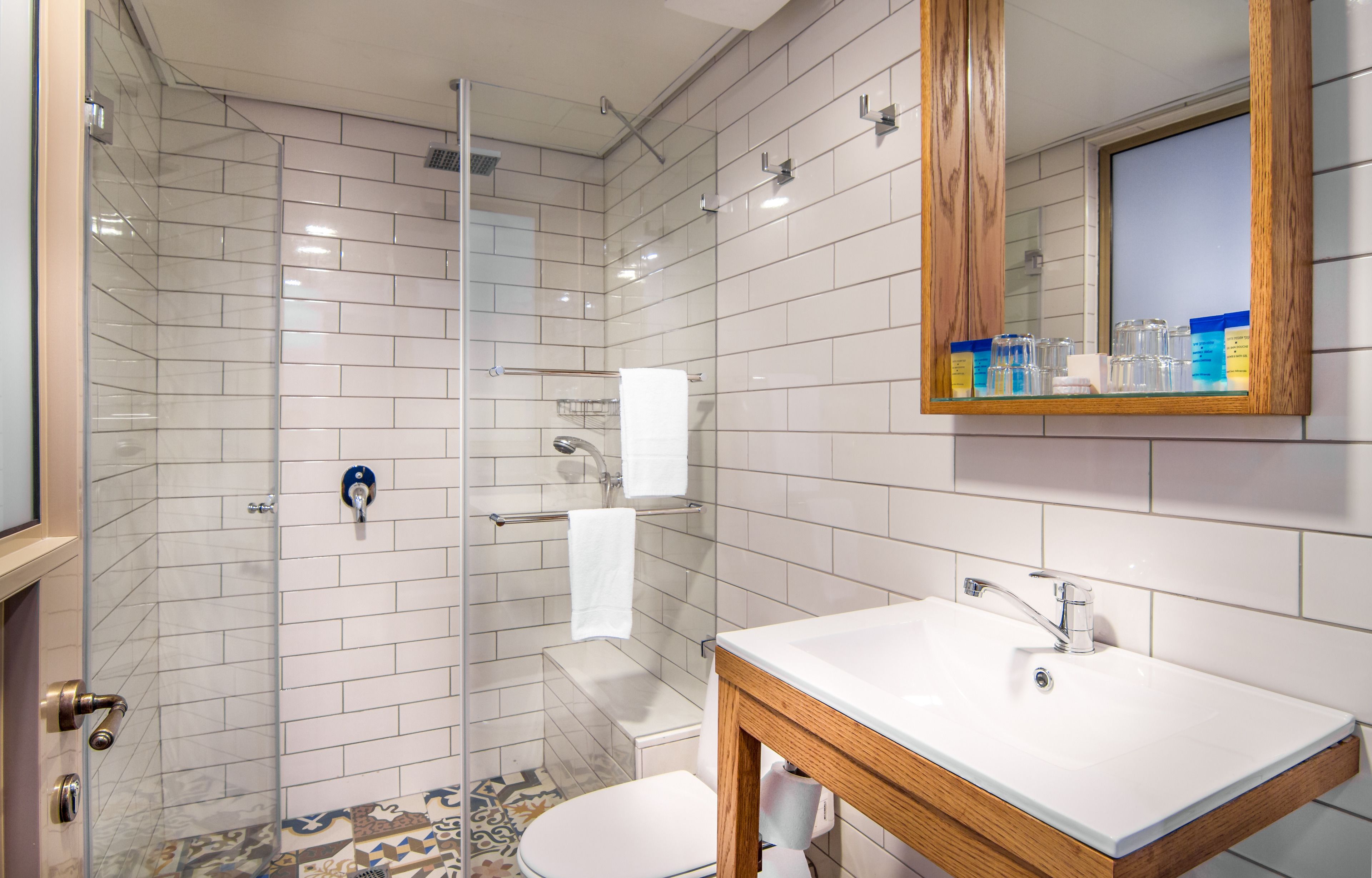 designer toiletries, hair dryer, towels