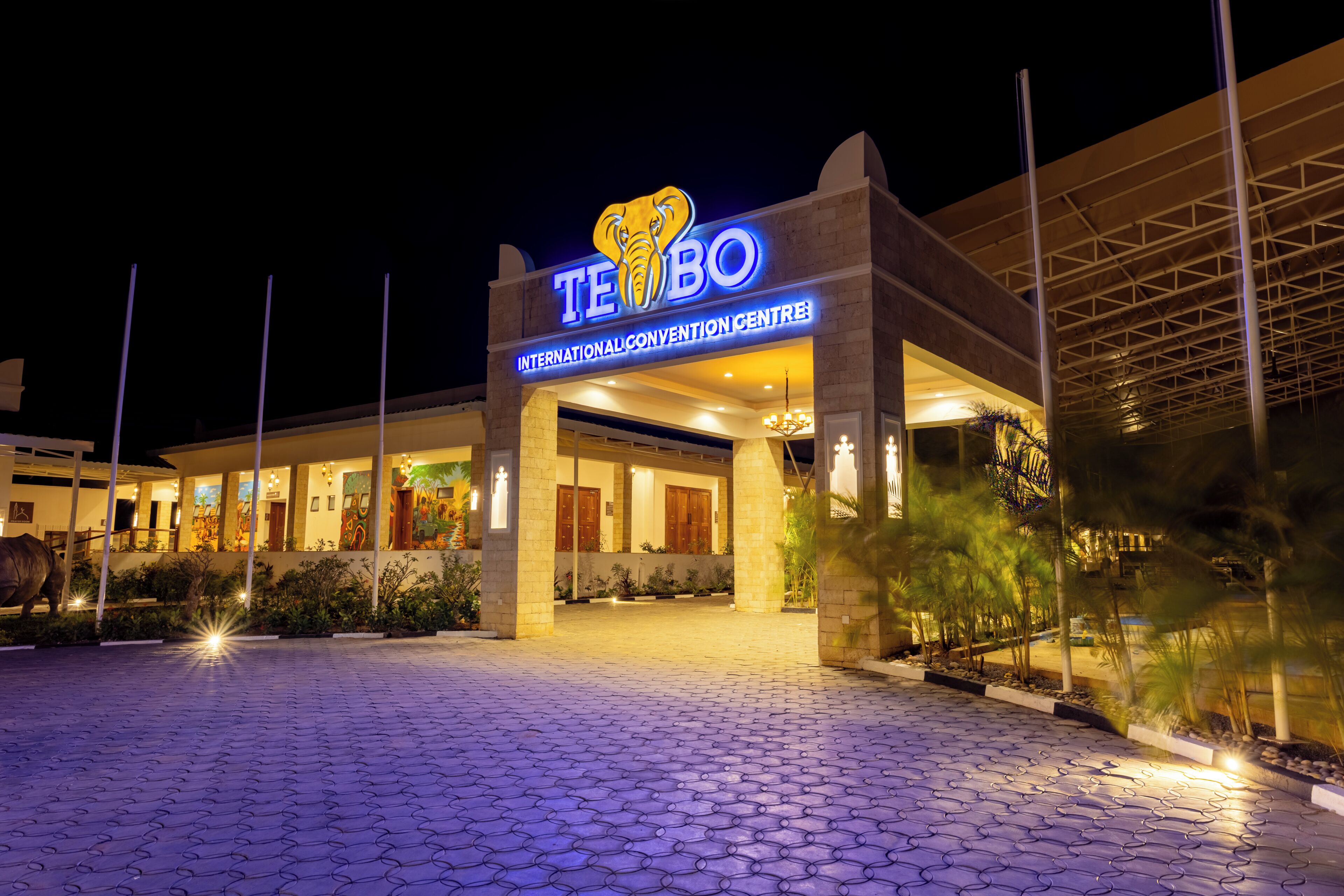A hotel entrance with a prominent sign reading 'TE BO INTERNATIONAL CONVENTION CENTRE'.
