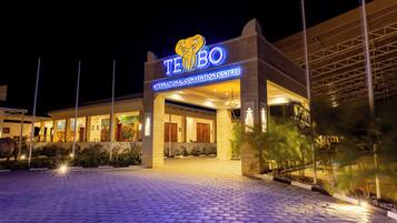 A hotel entrance with a prominent sign reading 'TE BO INTERNATIONAL CONVENTION CENTRE'.