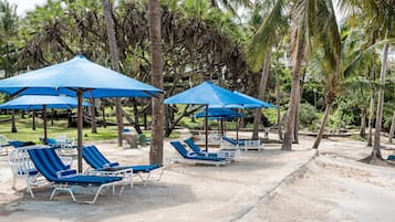 On the beach, sun loungers, beach umbrellas, beach towels