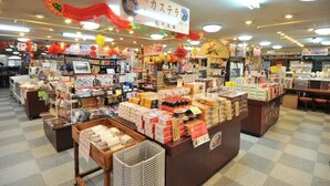 A well-lit indoor market with various stalls selling goods. - Hotel Saint Paul Nagasaki (Nagasaki)