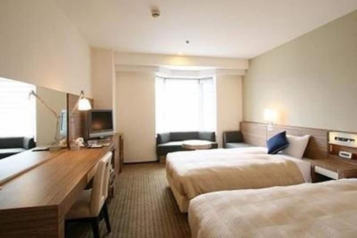 Down comforters, desk, blackout drapes, iron/ironing board