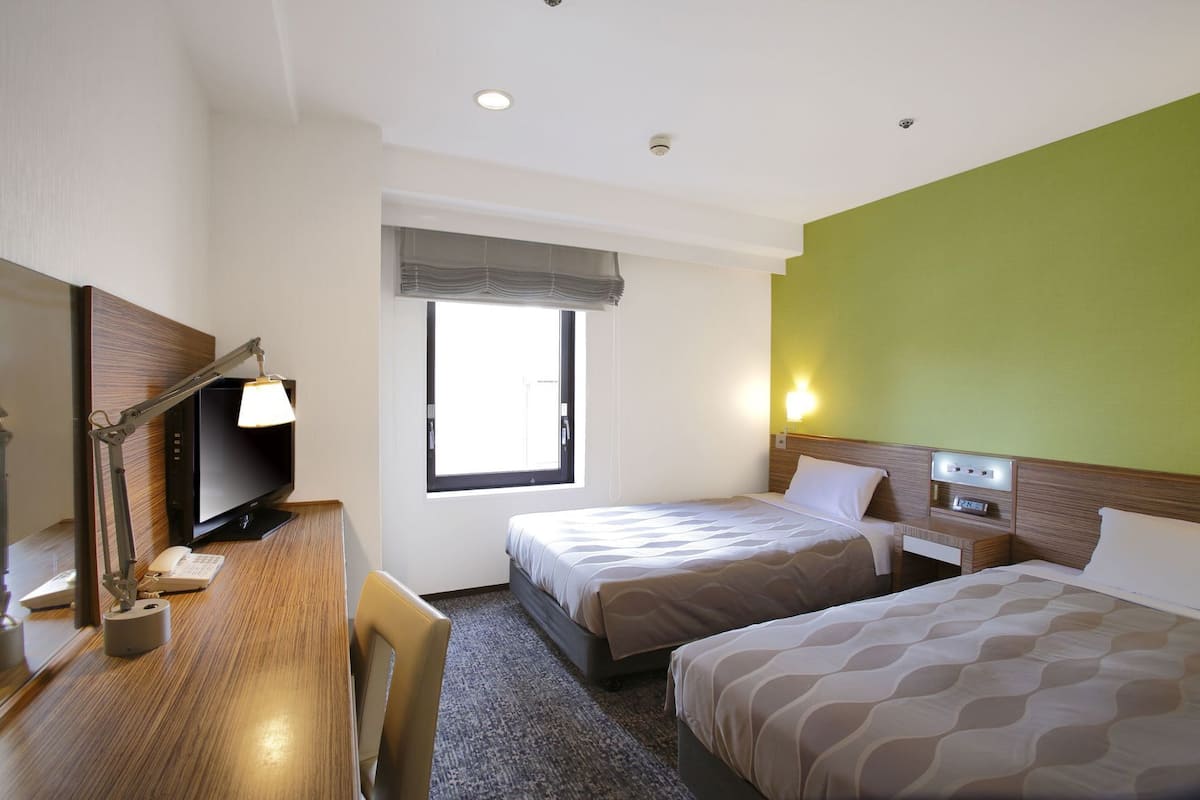 Down comforters, desk, blackout drapes, iron/ironing board