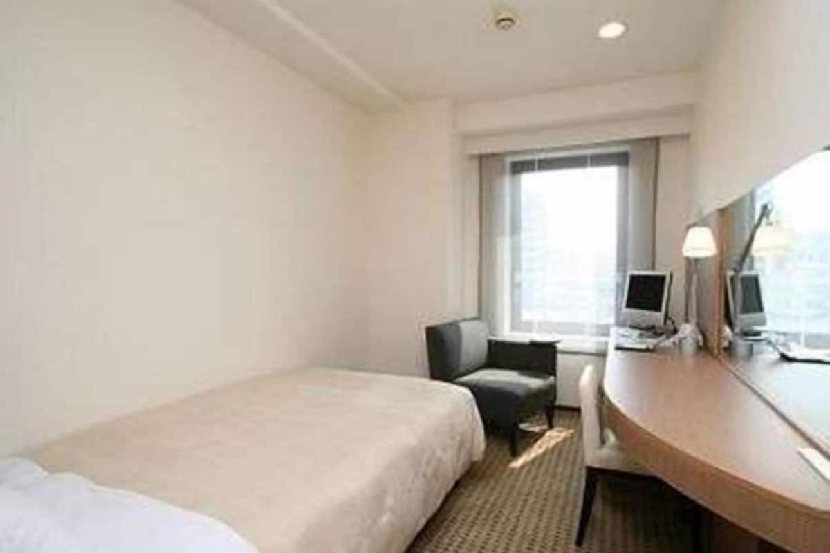 Down comforters, desk, blackout drapes, iron/ironing board