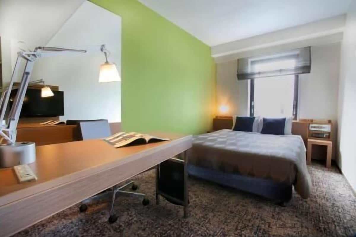 Down comforters, desk, blackout drapes, iron/ironing board