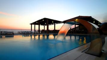 Outdoor pool, open 9:00 AM to 9:00 PM, pool umbrellas, pool loungers