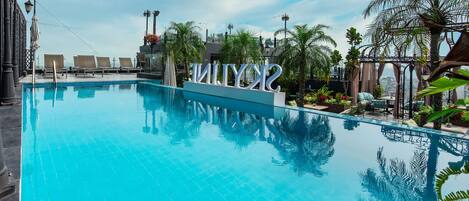 Outdoor pool, pool umbrellas, pool loungers