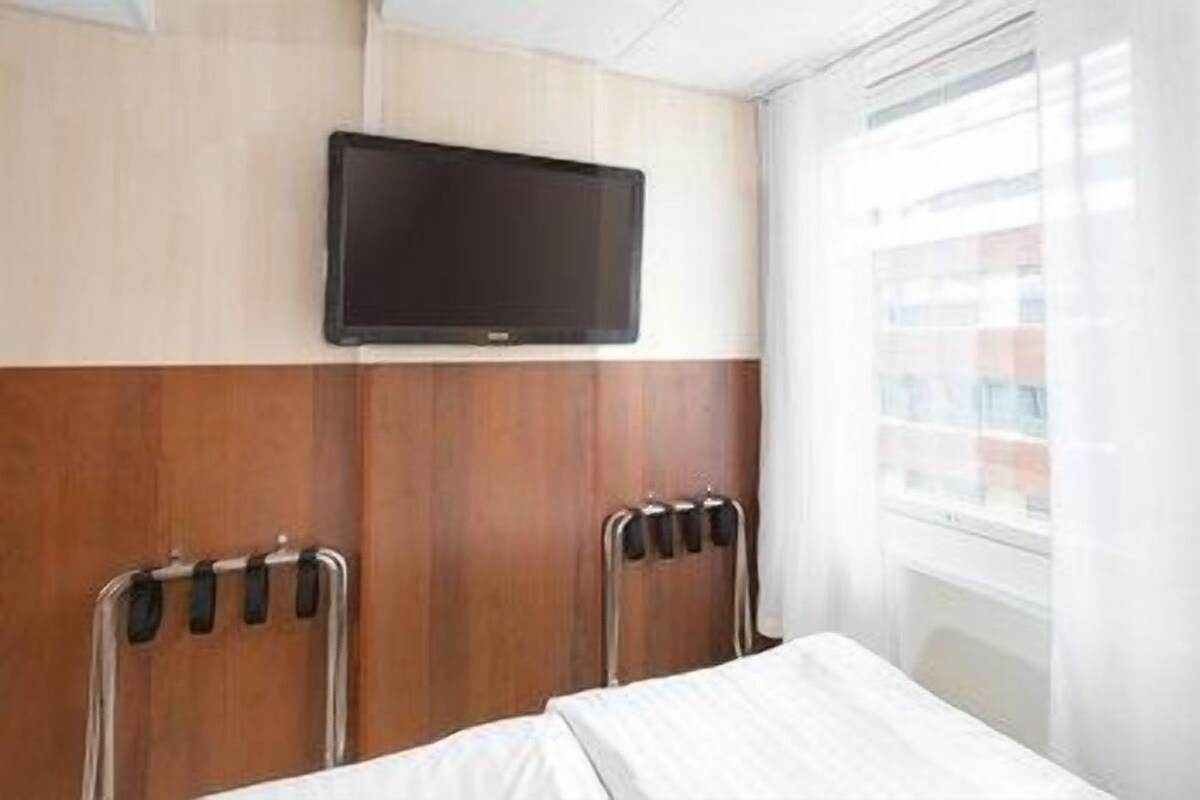 Verduisterende gordijnen, geluiddichte muren, gratis wifi, beddengoed