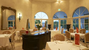 Breakfast, dinner served; local and international cuisine, garden views