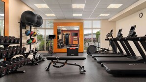 A gym with treadmills, dumbbells, kettlebells, and a bench. - Homewood Suites by Hilton Newport Middletown, RI (Middletown)