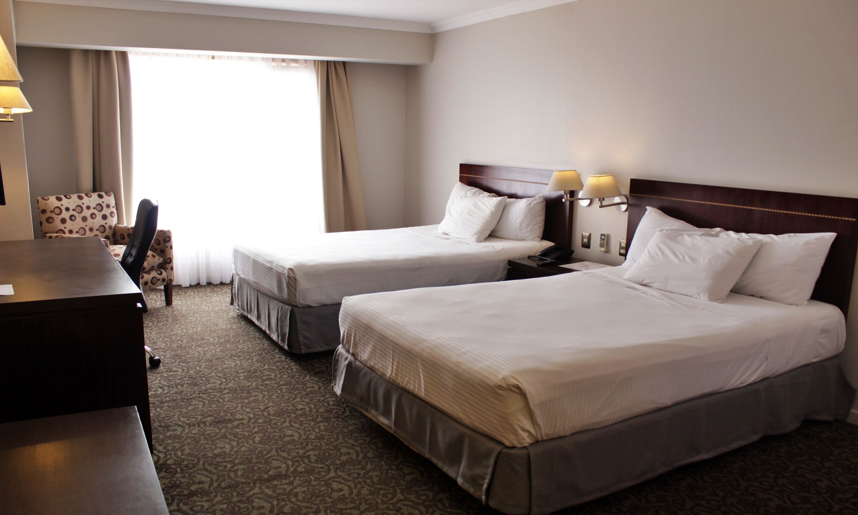 Standard Double Room | Minibar, in-room safe, desk, blackout drapes