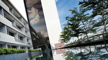 Outdoor pool, open 6:00 AM to 10:00 PM, pool loungers