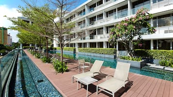 Outdoor pool, open 6:00 AM to 10:00 PM, pool loungers