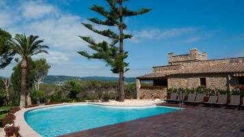 Outdoor pool, a rooftop pool, open 9 AM to 9 PM, pool loungers