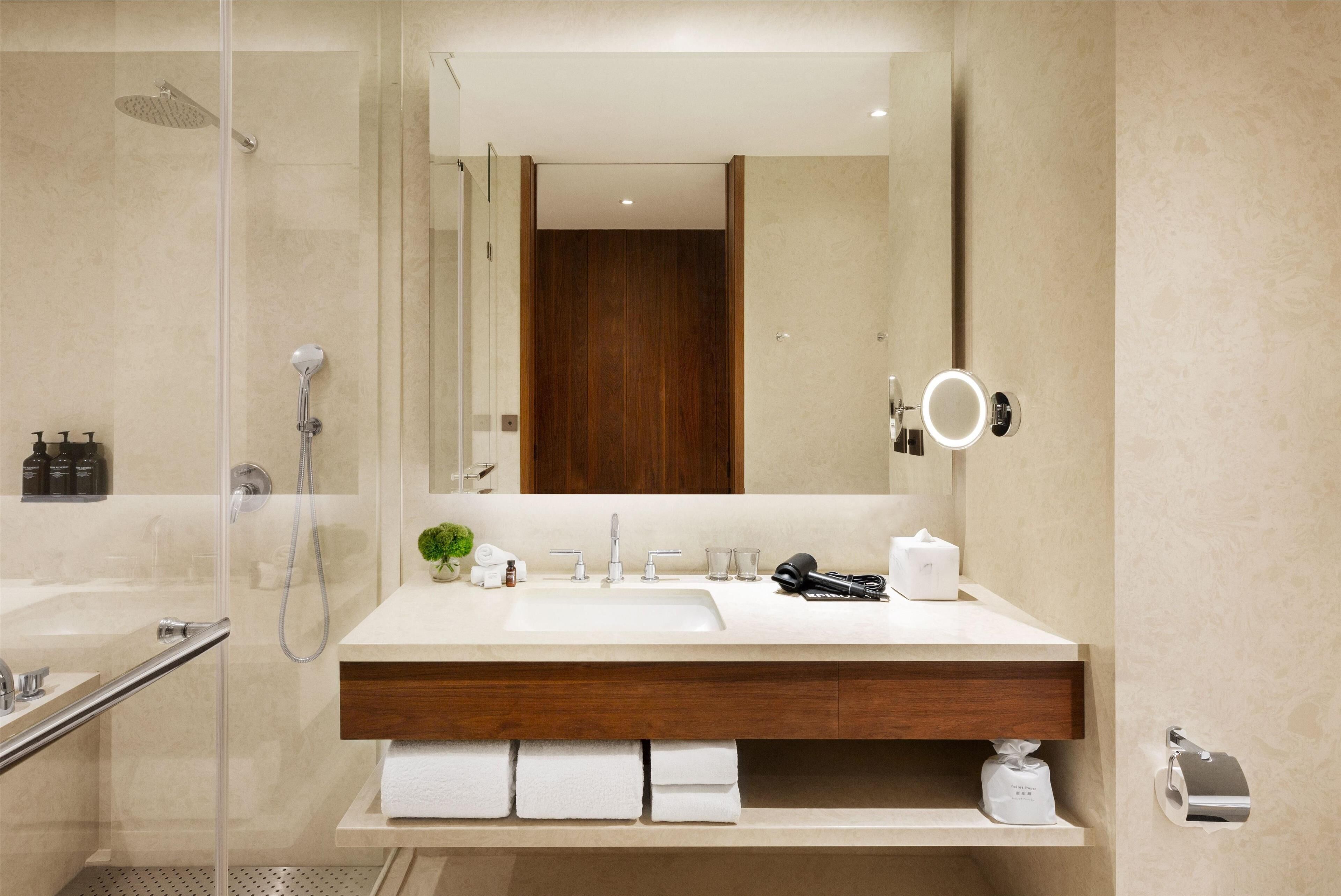 separate bathtub and shower, deep-soaking bathtub, designer toiletries