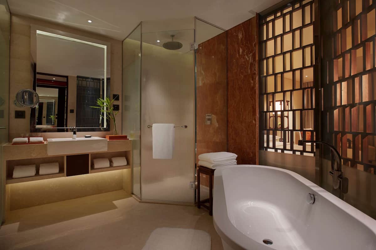 separate bathtub and shower, rainfall showerhead, hair dryer, bathrobes