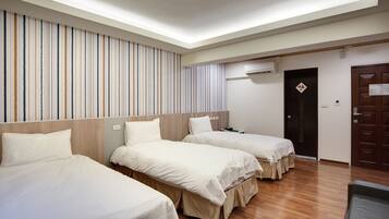 Standard Triple Room | Down comforters, individually furnished, desk, blackout drapes