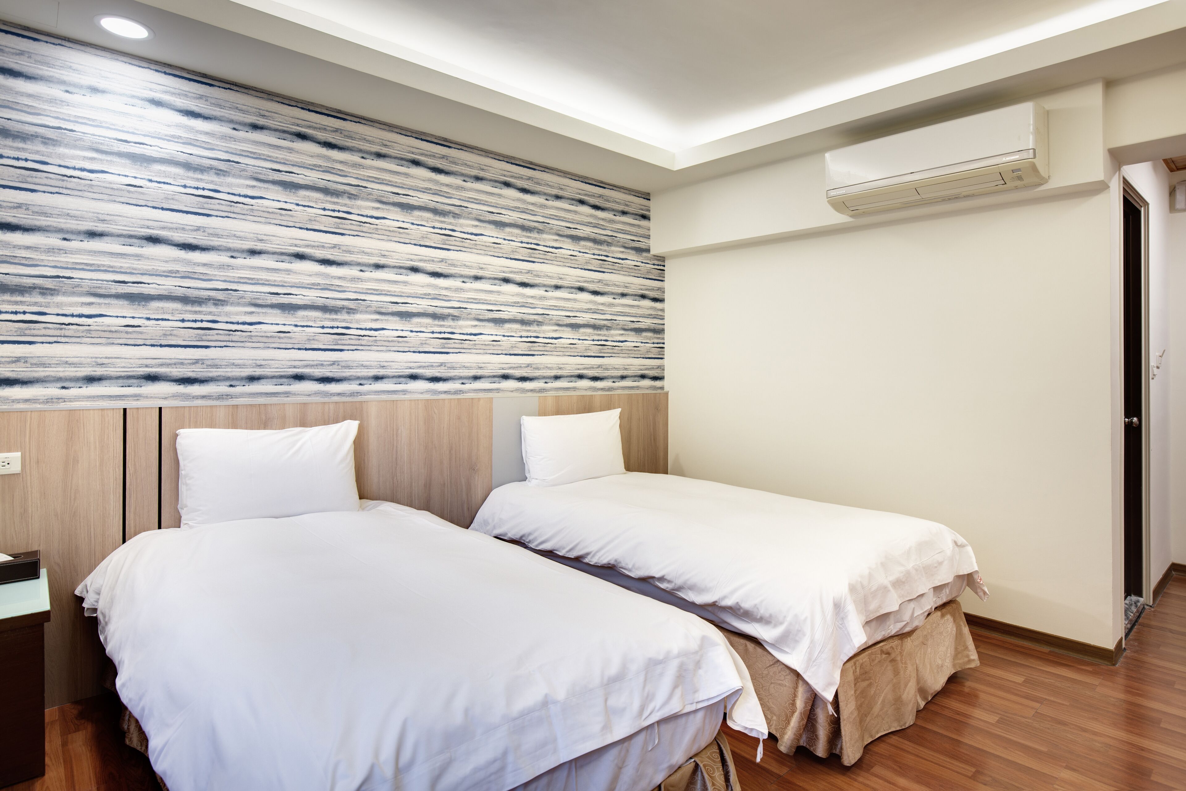 standard room, 2 single beds | down duvets, individually furnished, desk, blackout curtains