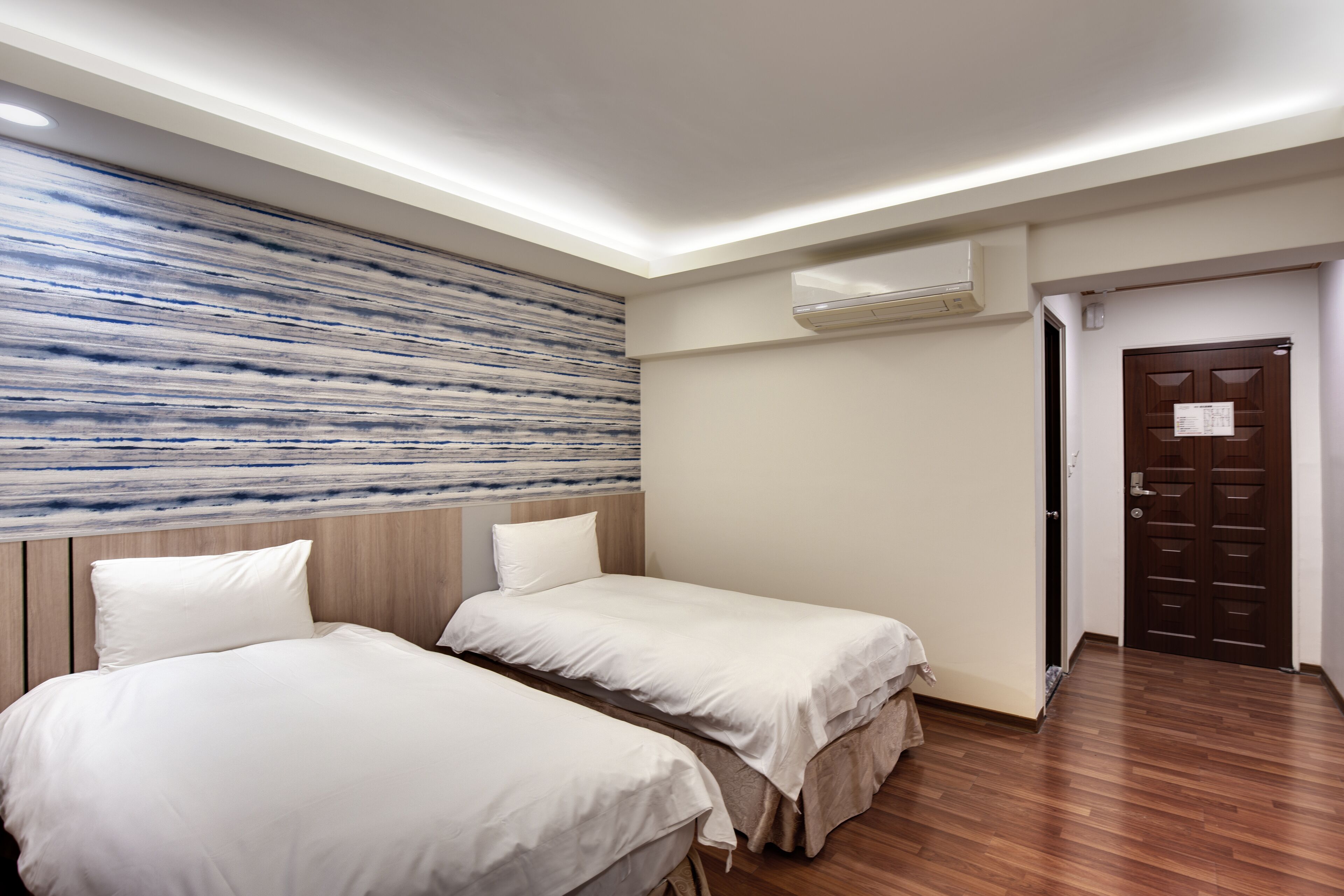 standard room, 2 single beds | down duvets, individually furnished, desk, blackout curtains