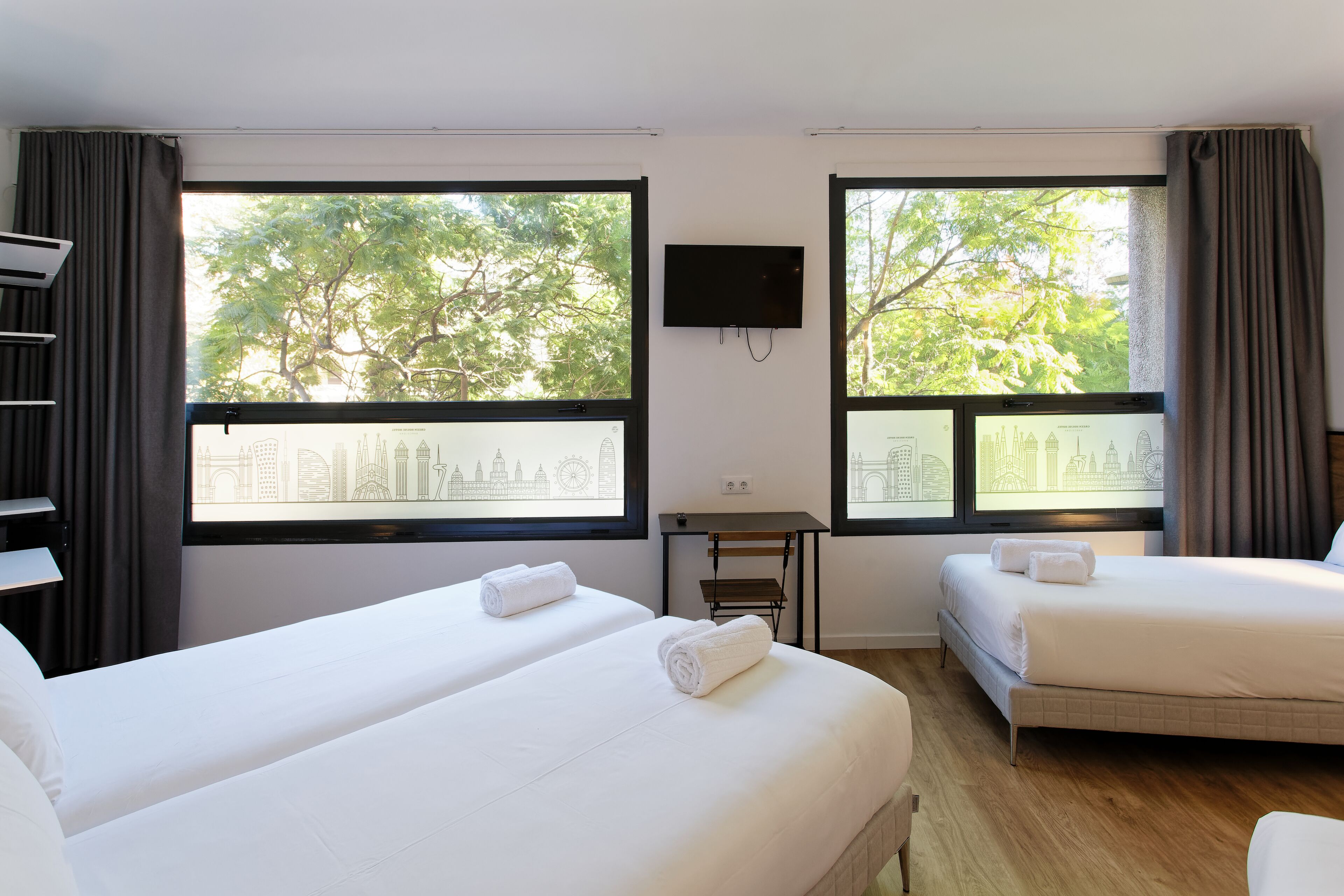 family room, city view | egyptian cotton sheets, premium bedding, down duvets, memory-foam beds