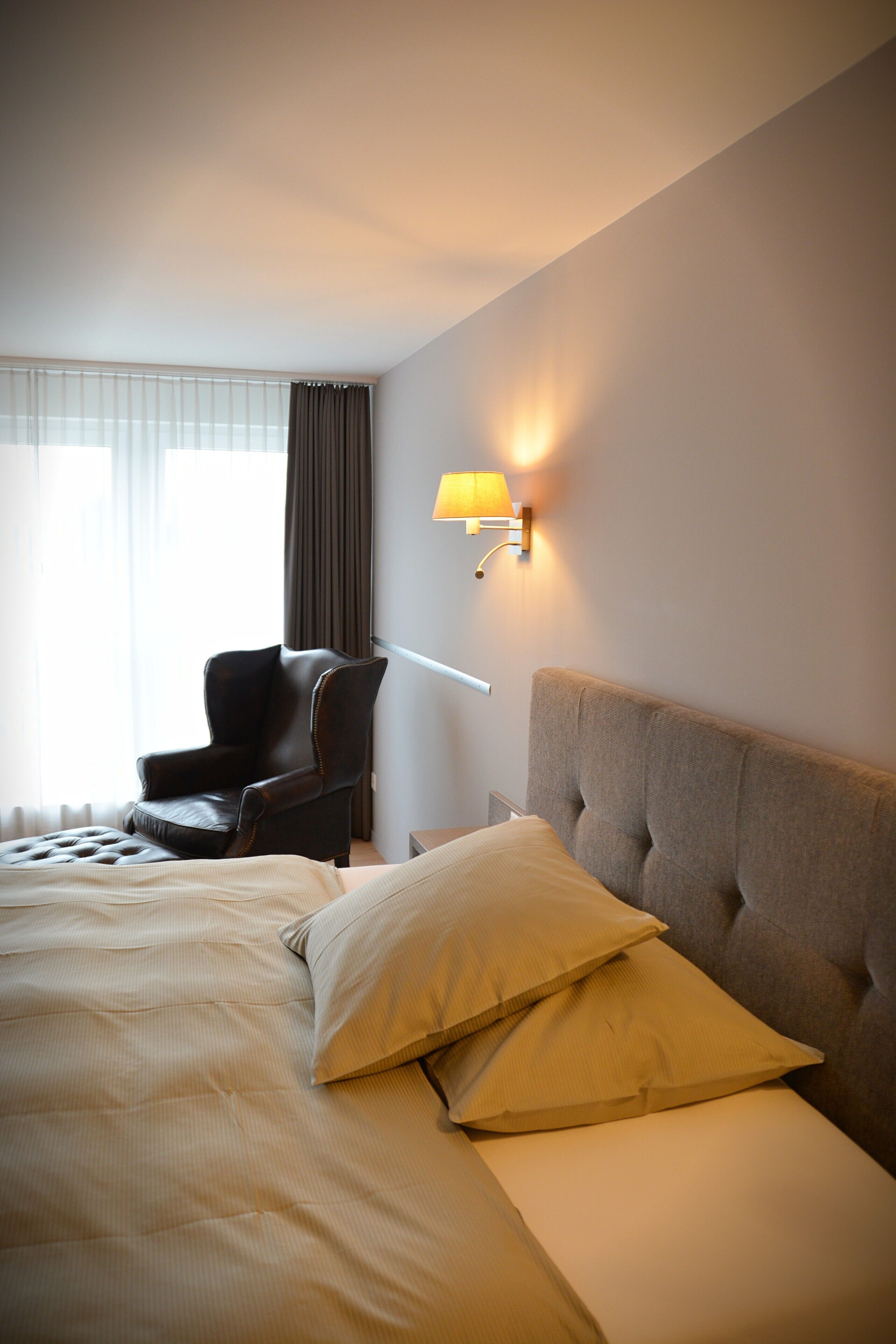 premium bedding, down duvets, memory-foam beds, in-room safe