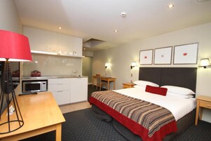 Executive Studio, Non Smoking, Jetted Tub (Executive Spa Studio) | Blackout drapes, iron/ironing board, WiFi, bed sheets