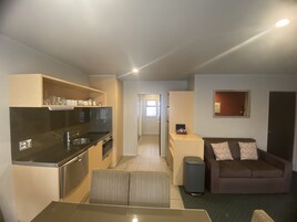 Apartment, 3 Bedrooms, Bathtub | Living area | 45-inch flat-screen TV with satellite channels, TV