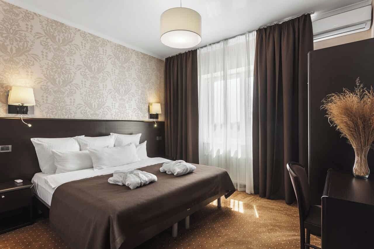 Luxury Suite, Terrace | Minibar, in-room safe, desk, laptop workspace
