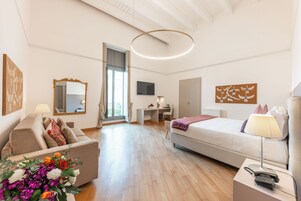 Deluxe Quadruple Room, Terrace, City View | Minibar, in-room safe, desk, blackout drapes