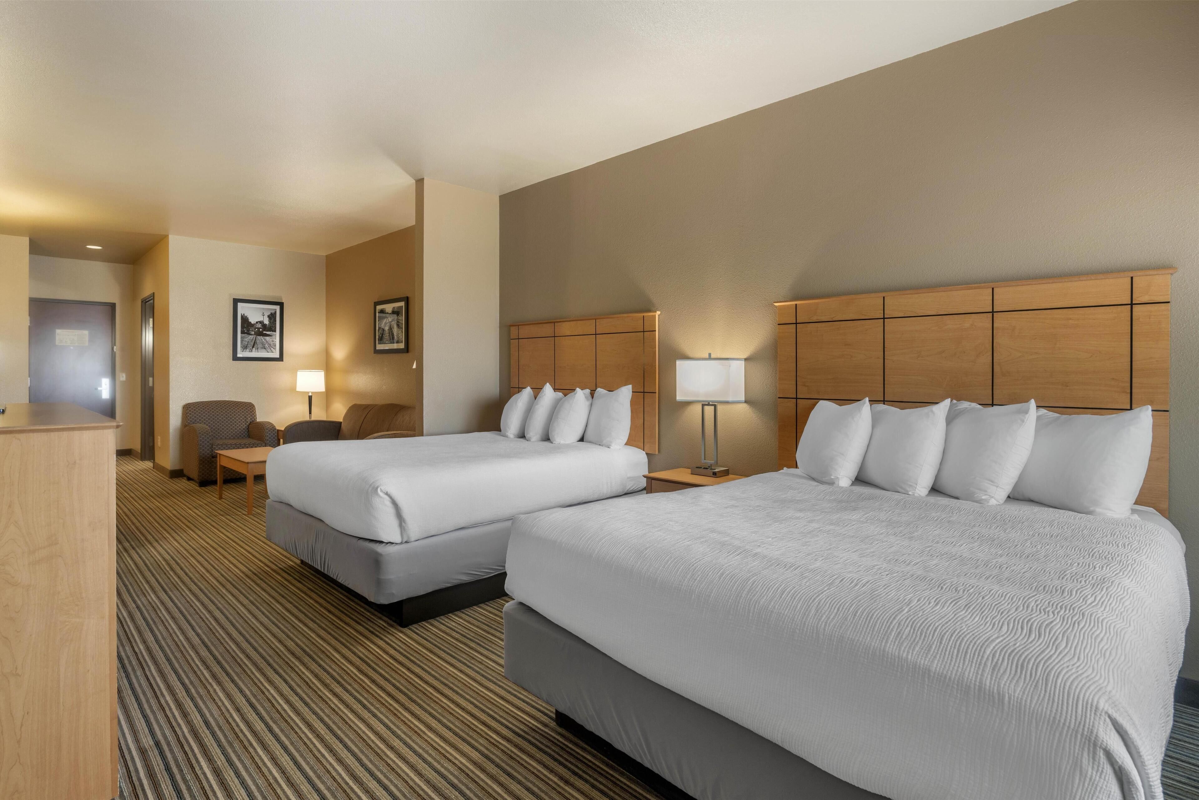 Suite, 2 Queen Beds, Non Smoking, Refrigerator & Microwave (Larger Room;with Sofabed) | Down comforters, desk, iron/ironing board, free cribs/infant beds