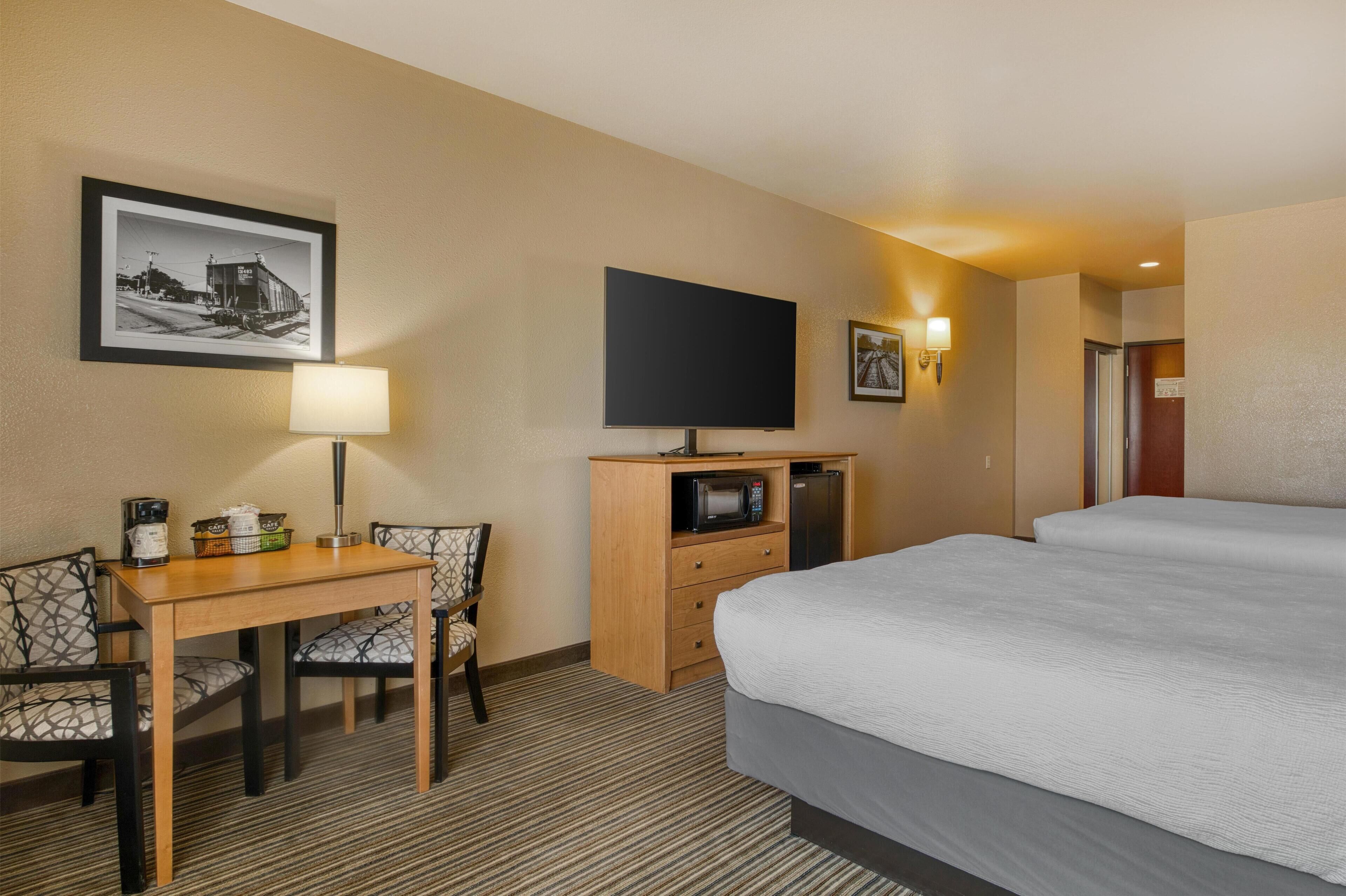 Down duvets, desk, iron/ironing board, free cots/infant beds