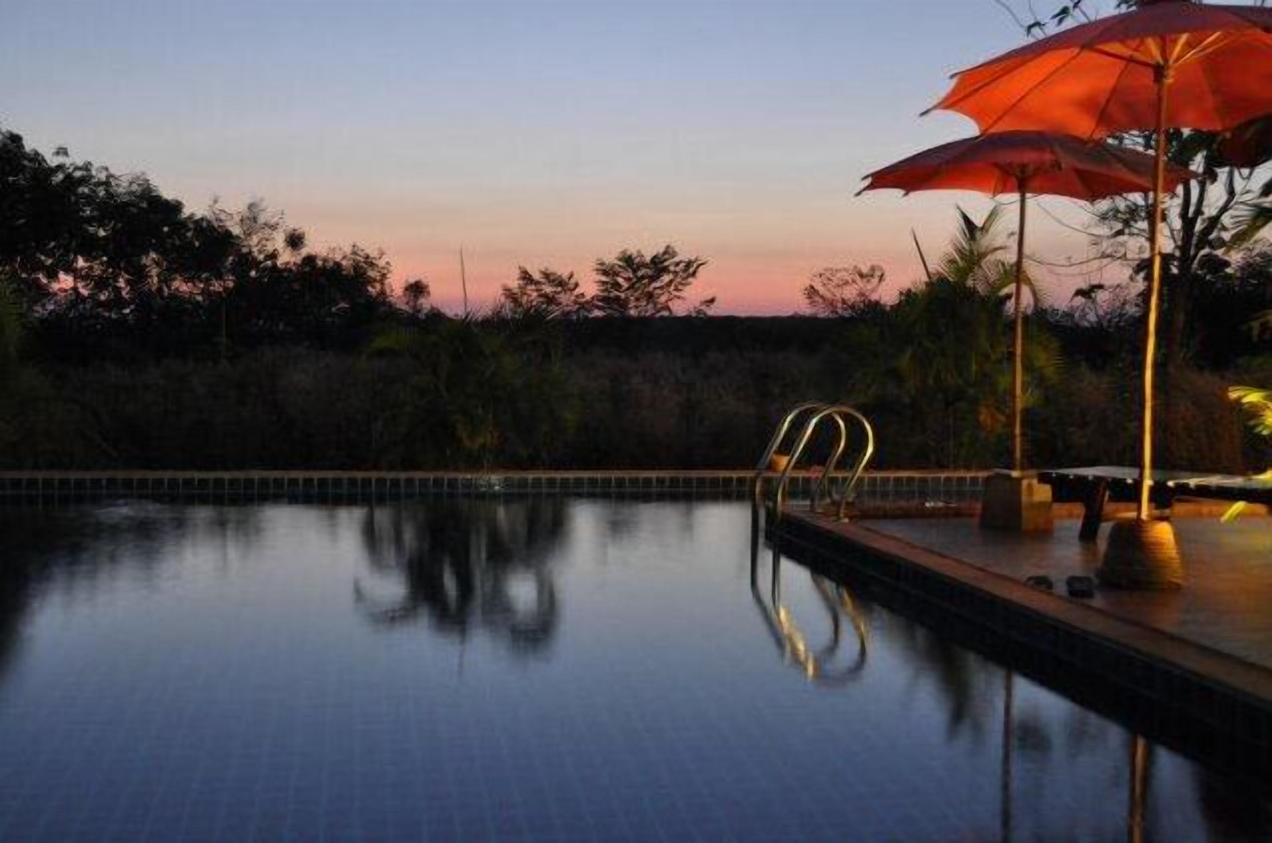 outdoor pool, pool umbrellas, pool loungers