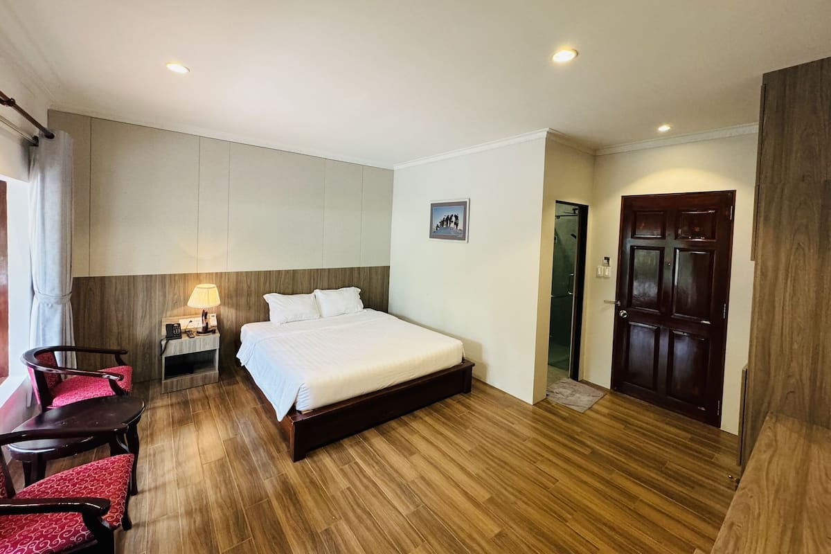 Deluxe Bungalow, River View | Minibar, in-room safe, desk, blackout drapes