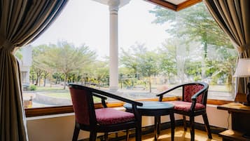 Superior Room, Garden View | Living area | 24-inch TV with cable channels, pay movies