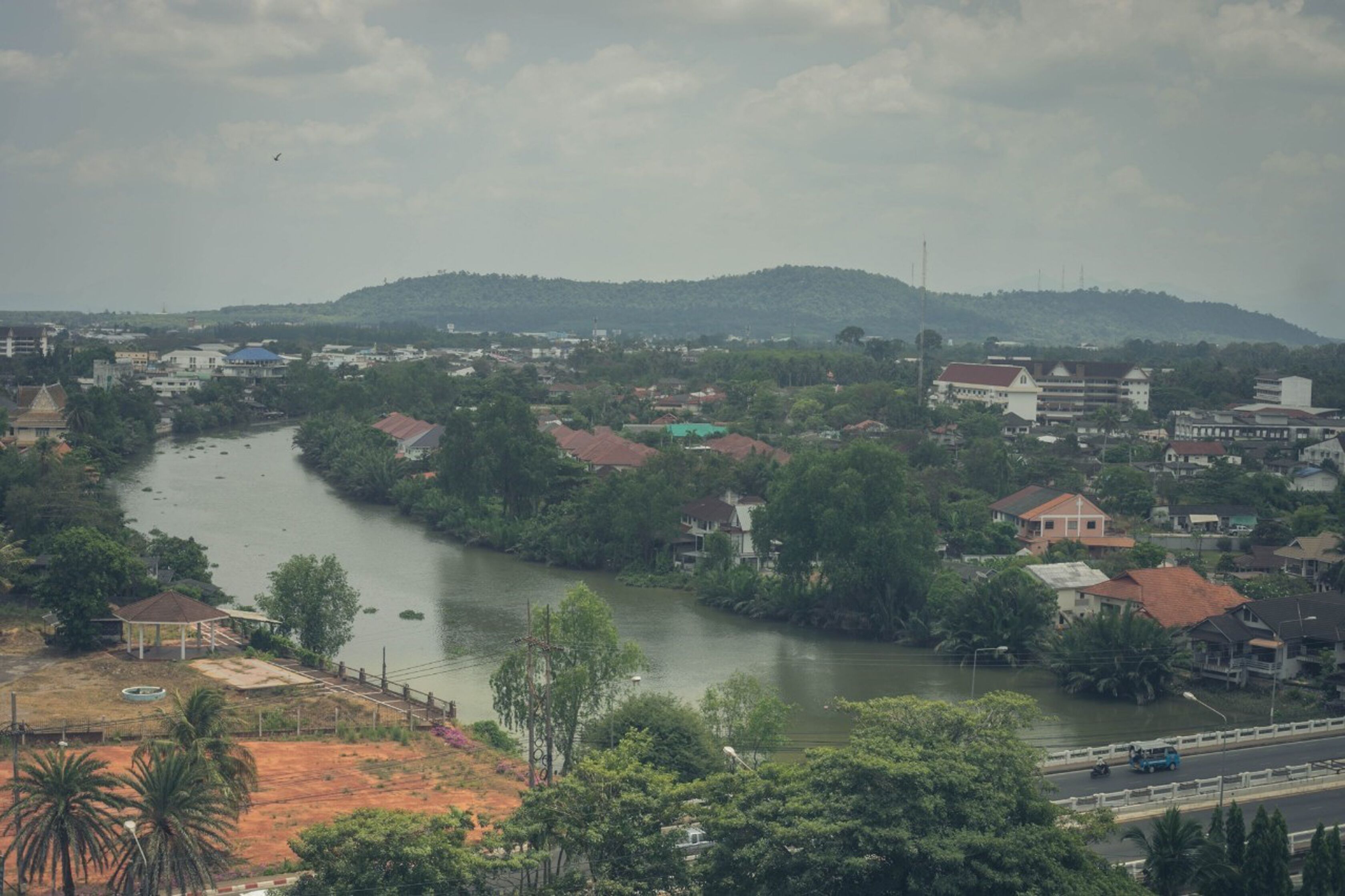 A river flowing through a town with buildings on both sides.