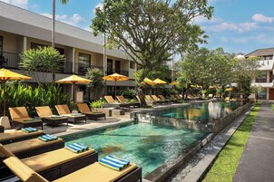 2 outdoor pools, open 9:00 AM to 9:00 PM, pool umbrellas, pool loungers
