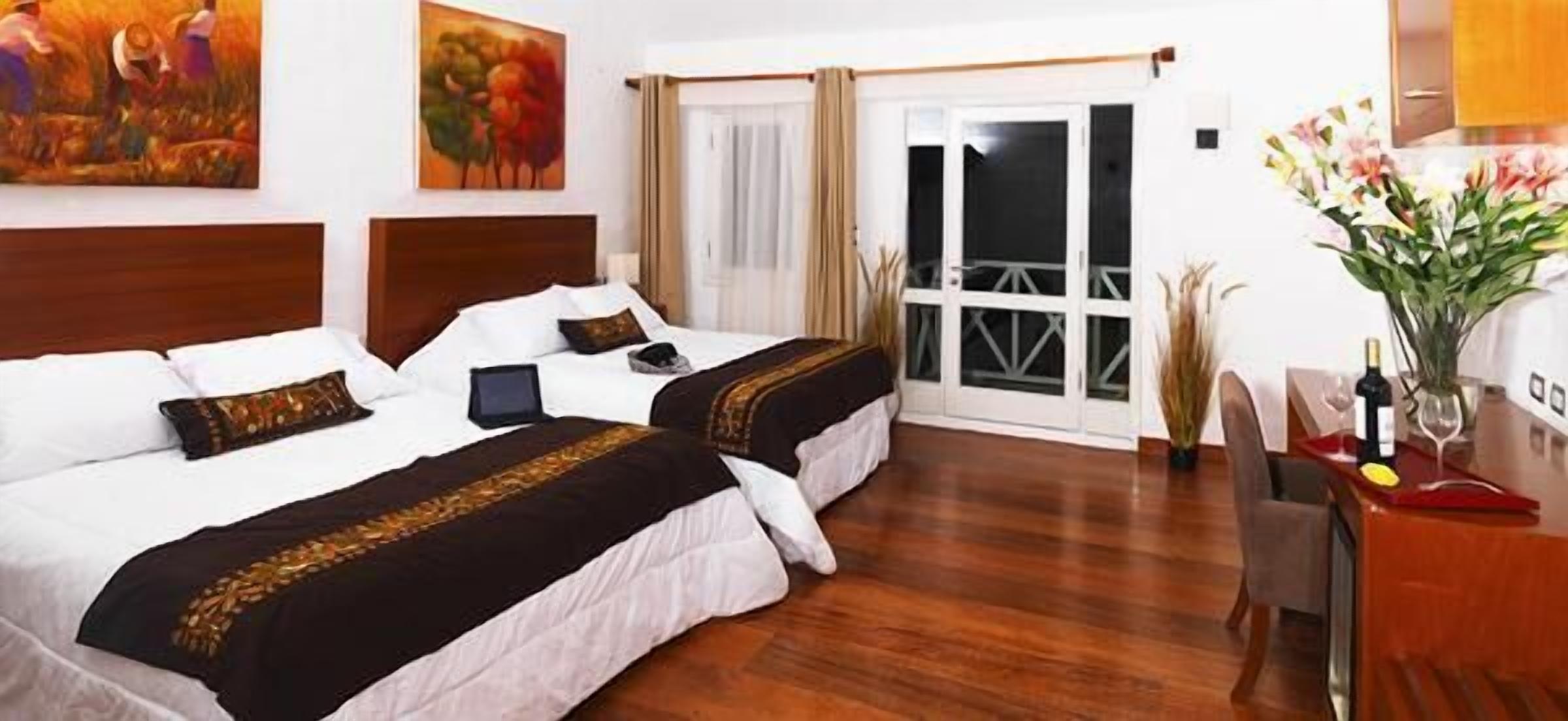 deluxe room | minibar, in-room safe, desk, free wifi