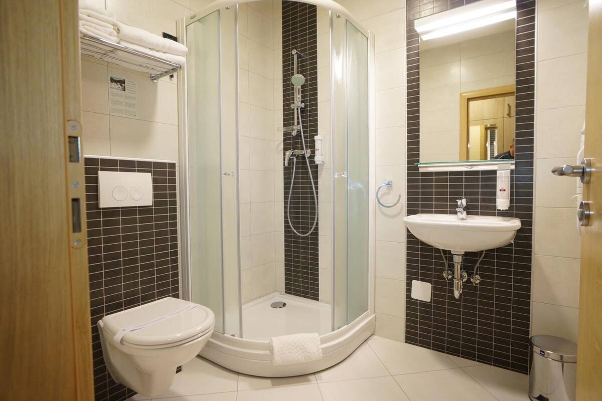 shower, rainfall showerhead, hair dryer, slippers