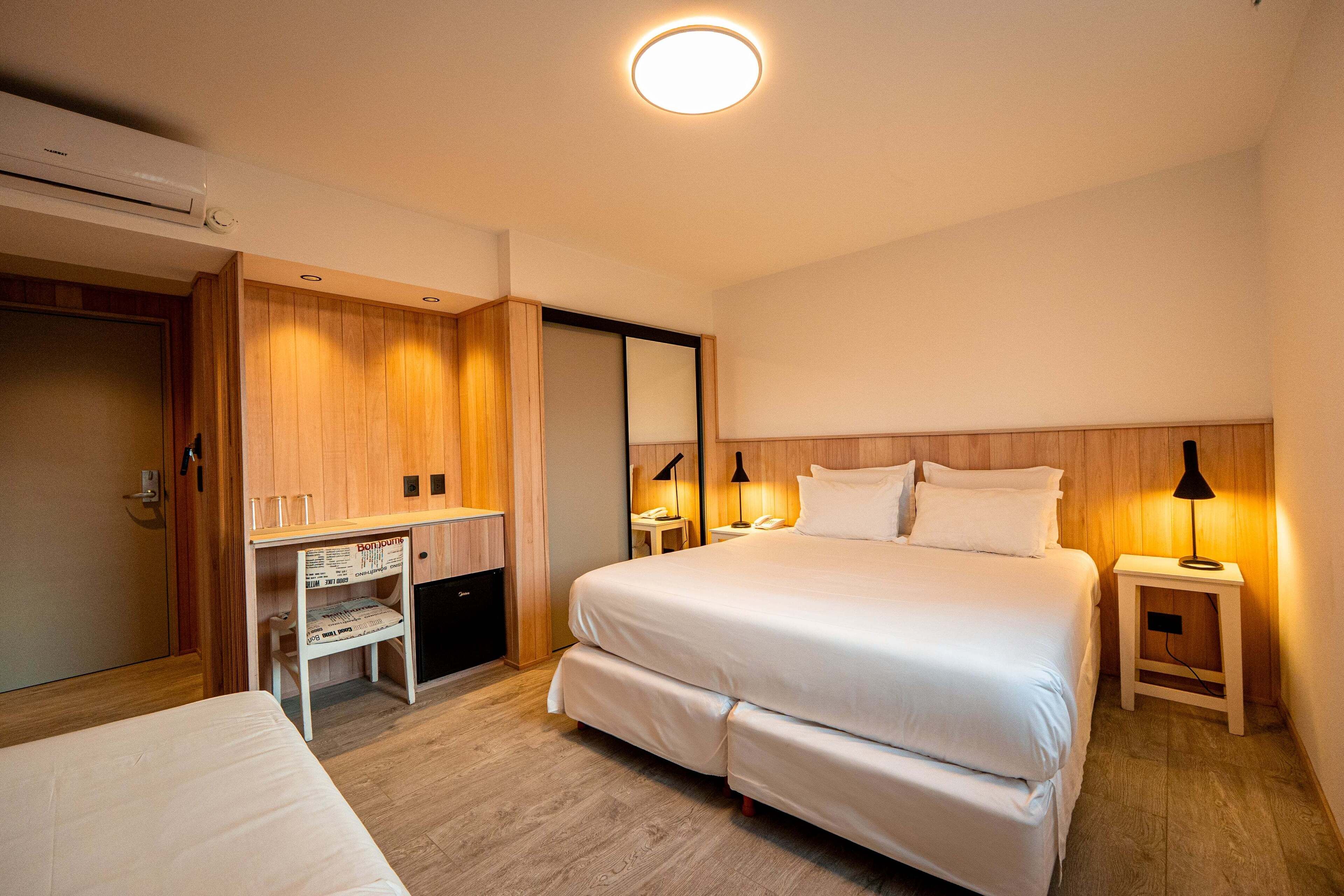 Deluxe Triple Room | Premium bedding, minibar, in-room safe, blackout drapes