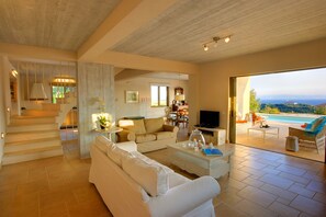 Grand Villa, 3 Bedrooms | Living room | Flat-screen TV, DVD player