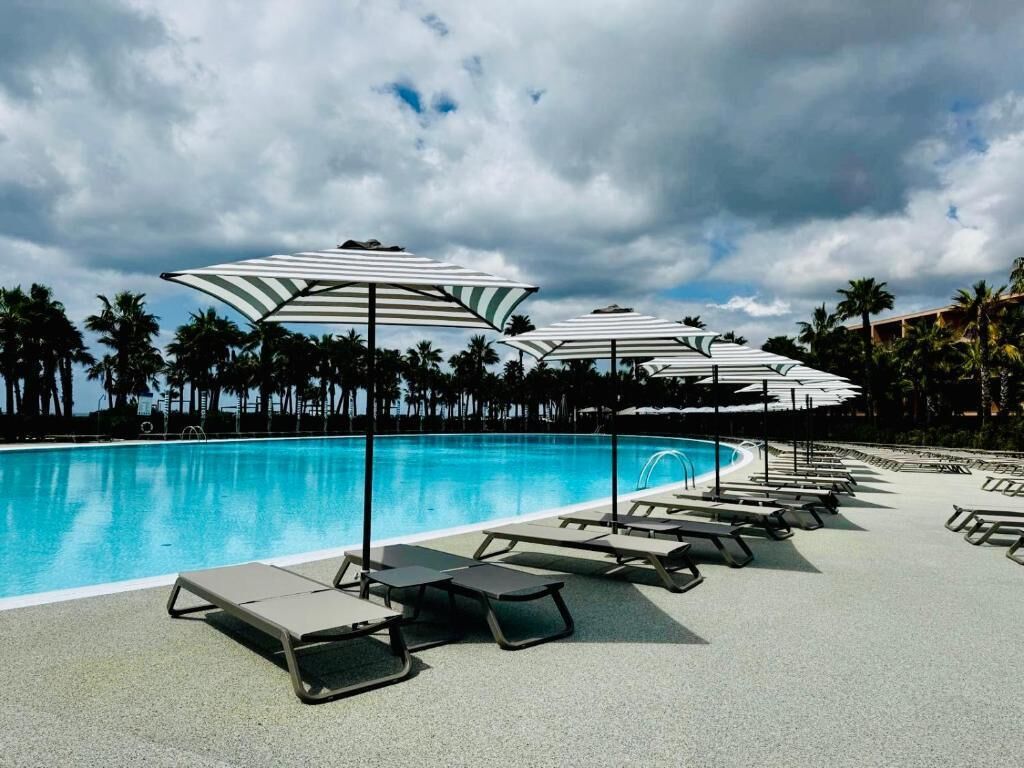 indoor pool, 2 outdoor pools, open 10:00 am to 6:00 pm, pool umbrellas