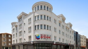 A multi-story building with a curved facade, large windows, and a prominent sign for Ramada Encore by Wyndham. - Ramada Encore by Wyndham Konya Karatay (Konya)