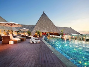 Outdoor pool, open 8:00 AM to 8:00 PM, pool umbrellas