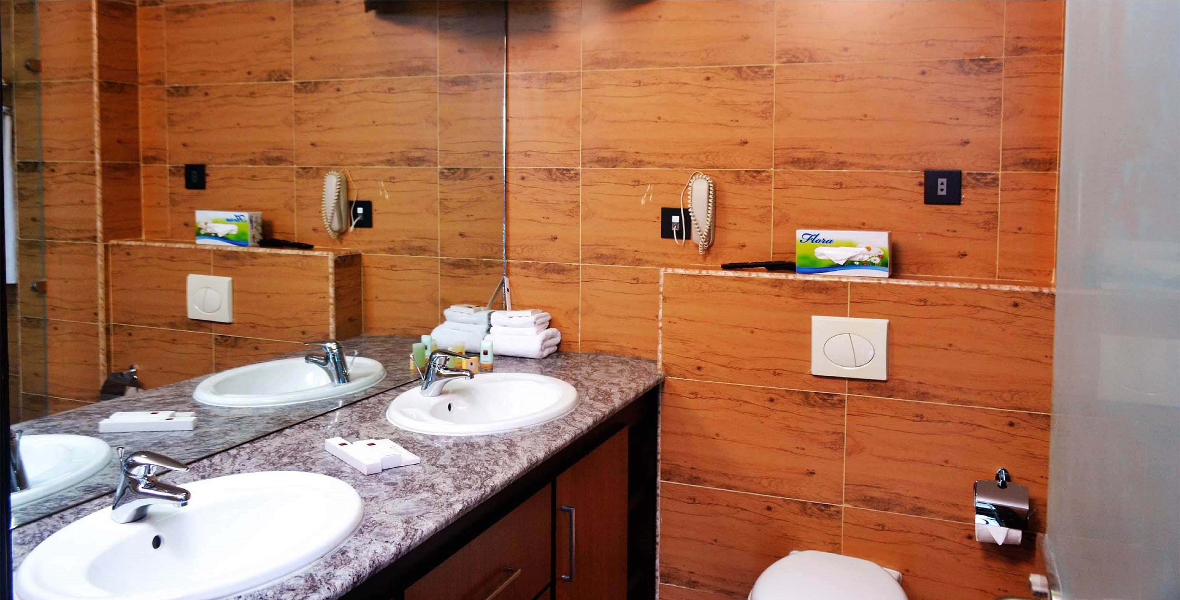 deluxe room, 1 queen bed, non smoking, sea view | in-room safe, desk, iron/ironing board, free cots/infant beds